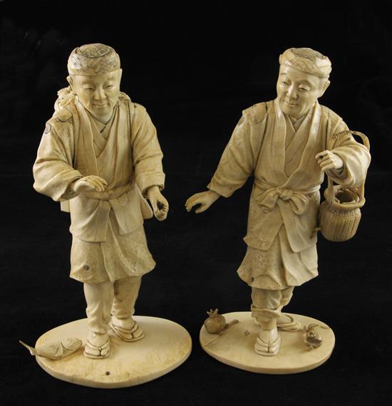 A pair of Japanese bone and ivory sectional figures of fruit pickers, early 20th century, 21cm and 22cm, losses